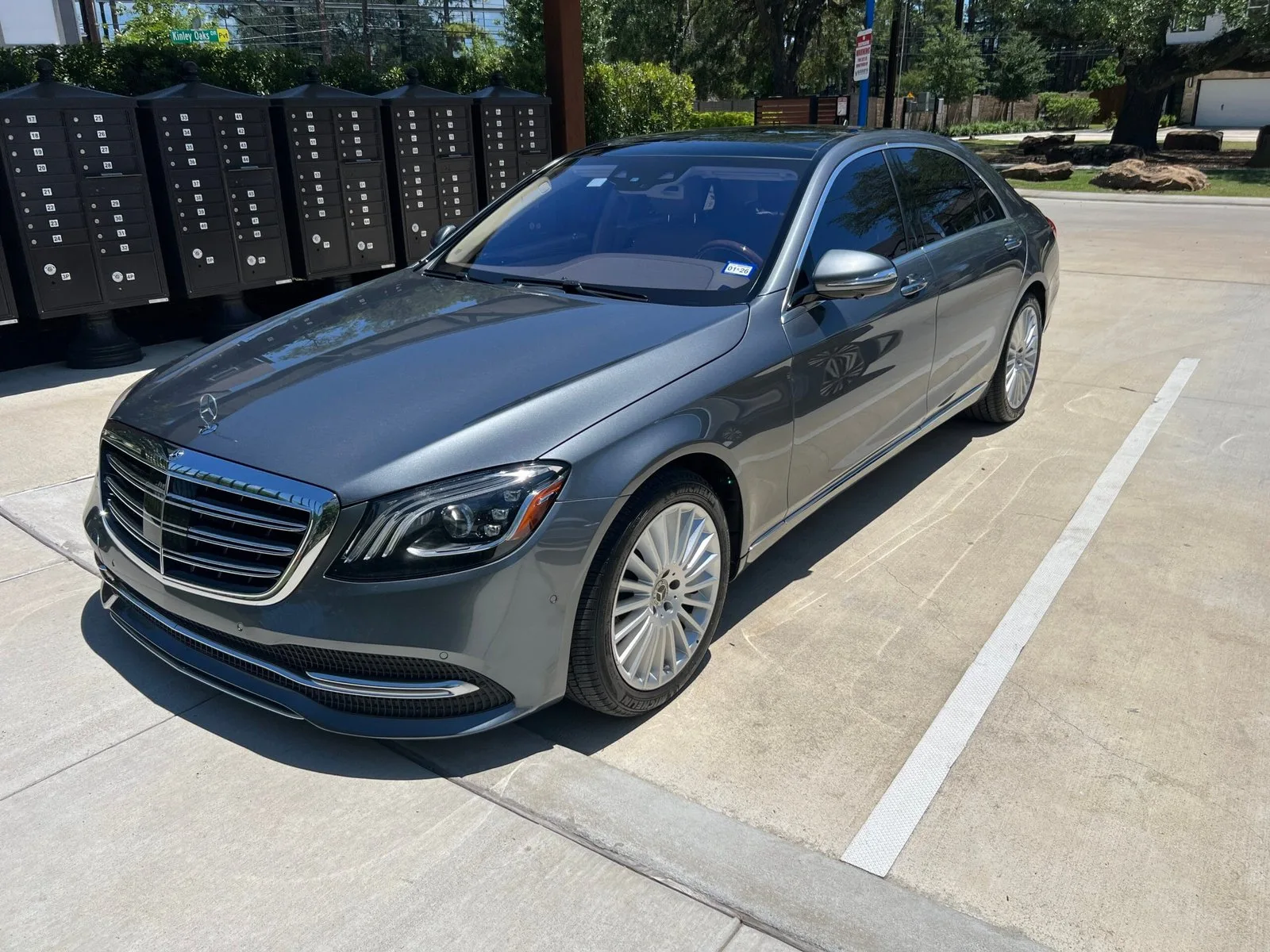 Gray Mercedes-Benz S-Class after an Azul exterior detail, parked beside a row of mailboxes