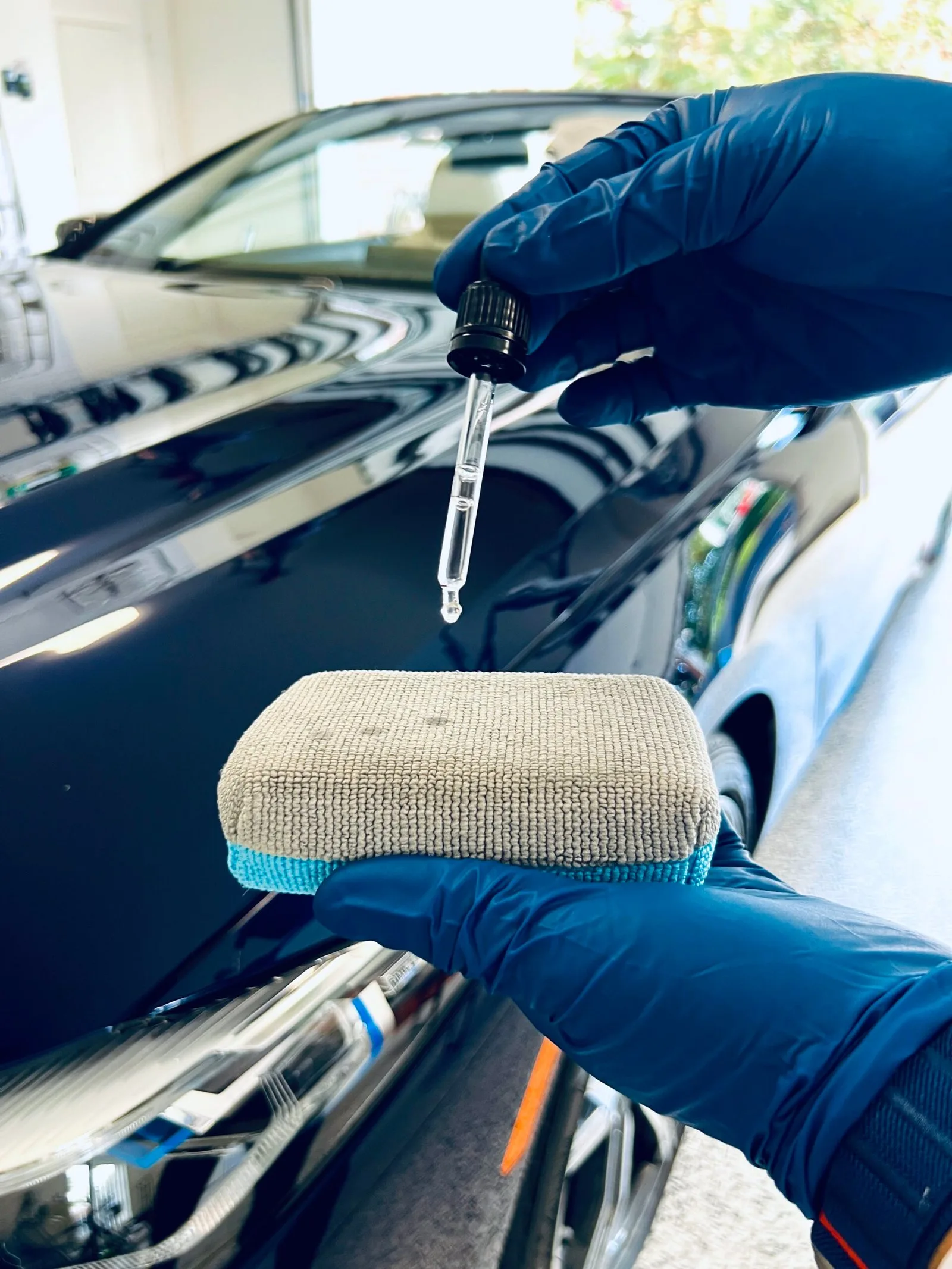Houston auto detailing ceramic coating application on black paint