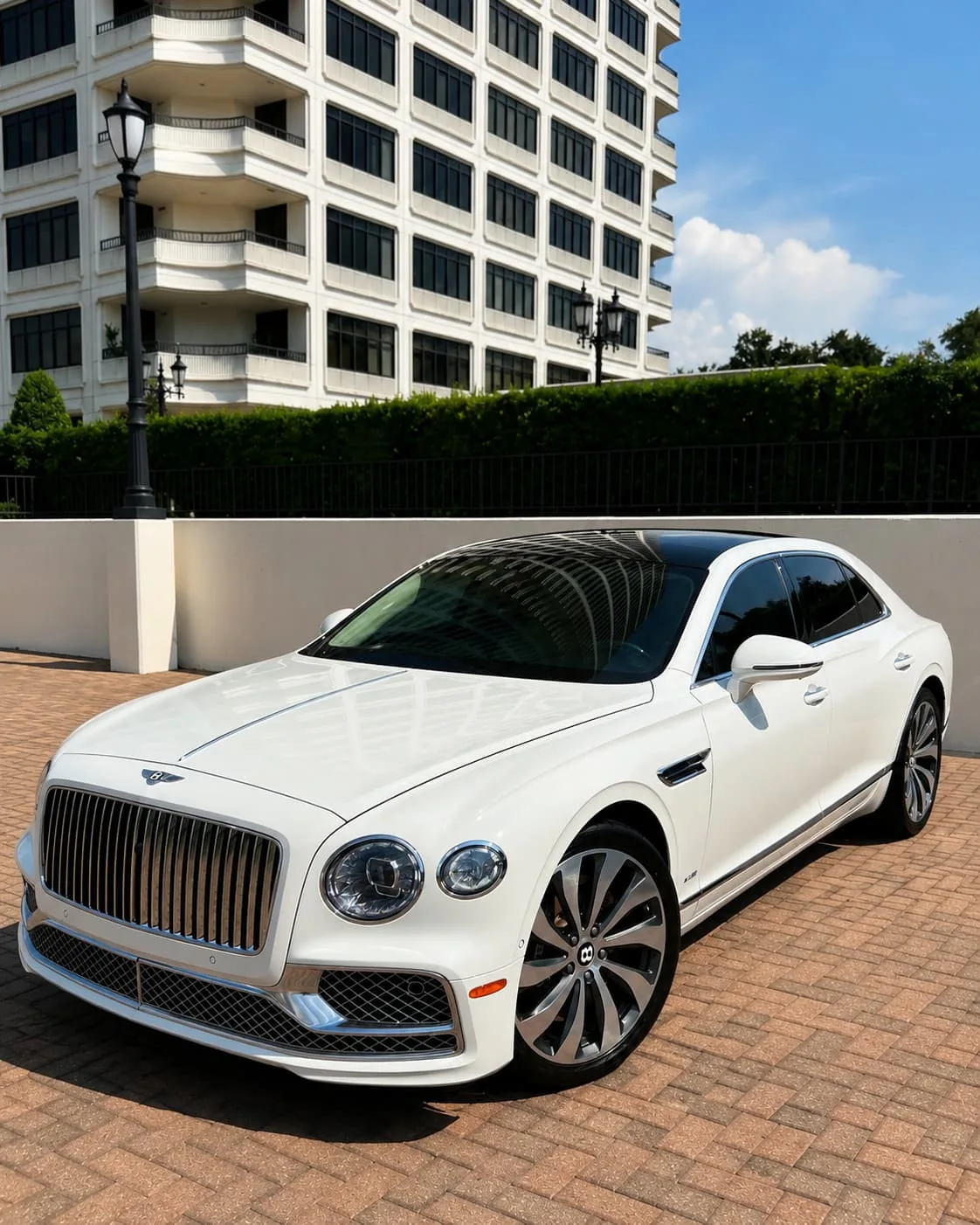 white-bentley-mobile-detailing-houston White Bentley sedan after premium ceramic coating maintenance wash by Azul Auto Detailing in Houston