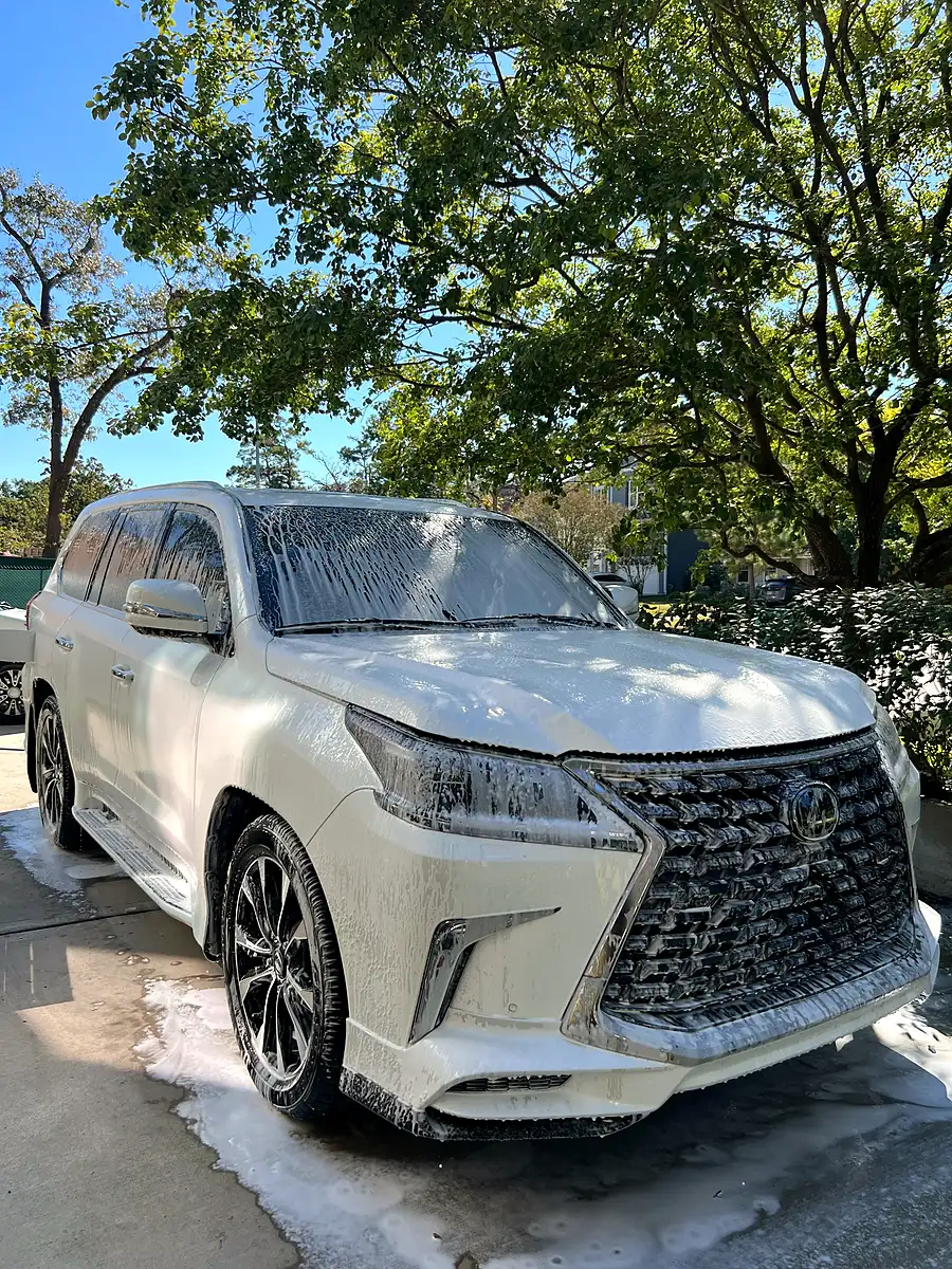 Professional mobile detailing service at a residential driveway in Pearland TX