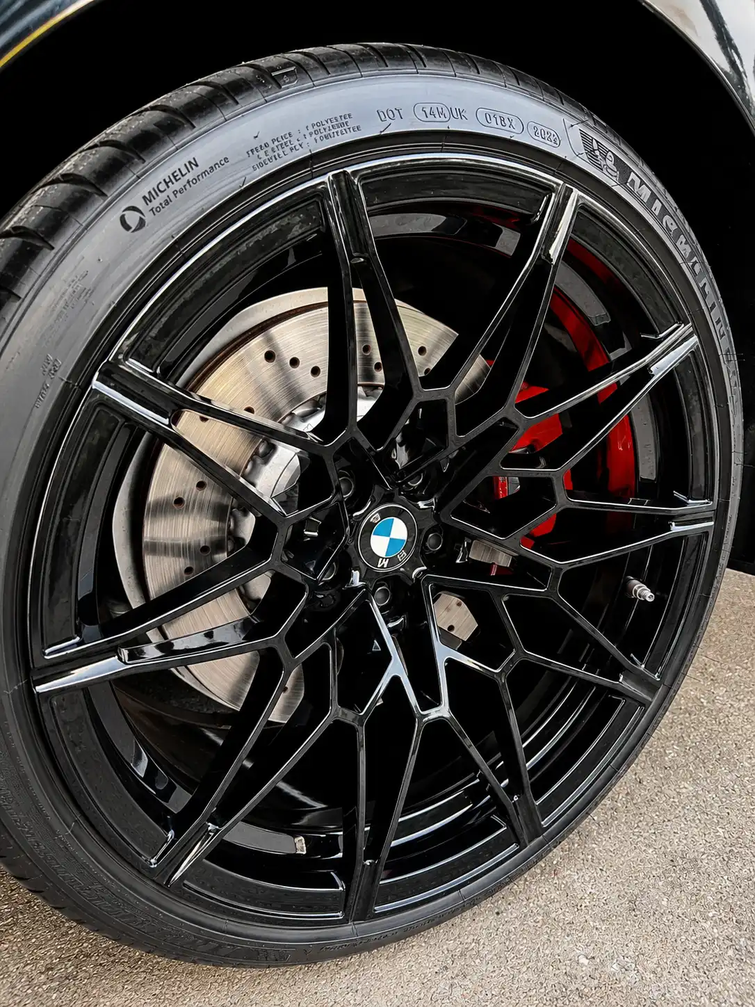 Professional mobile detailing and wheel coating service at a Sugar Land TX residential driveway