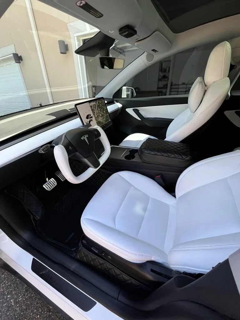 Tesla Model Y white leather interior after ceramic coating showing protected finish