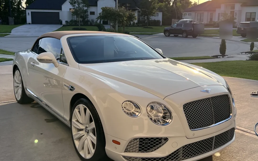 White Bentley Continental GTC after an Azul detail, on a driveway in Sienna