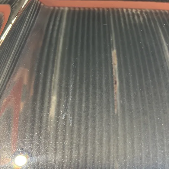 Bird-dropping etch mark and swirls on black paint
