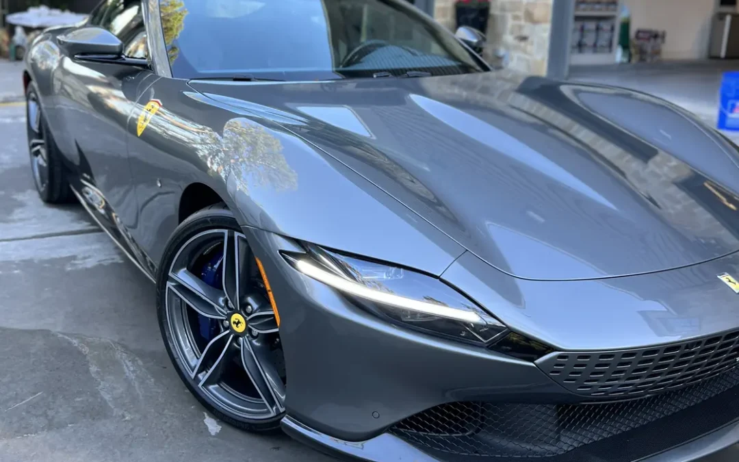 Grey Ferrari Roma after an Azul ceramic coating, parked outside the client's garage in Houston