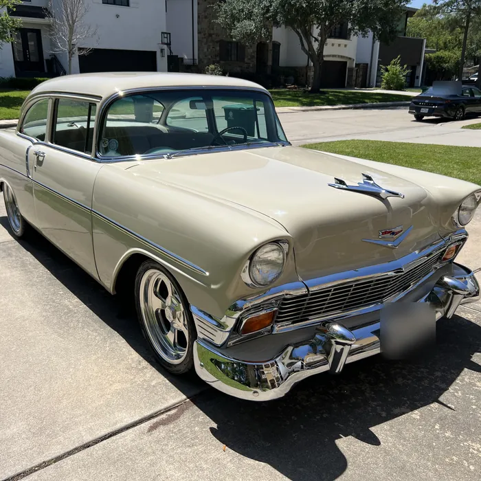 Classic cream Chevrolet Bel Air after a detail, on a driveway near West University Place