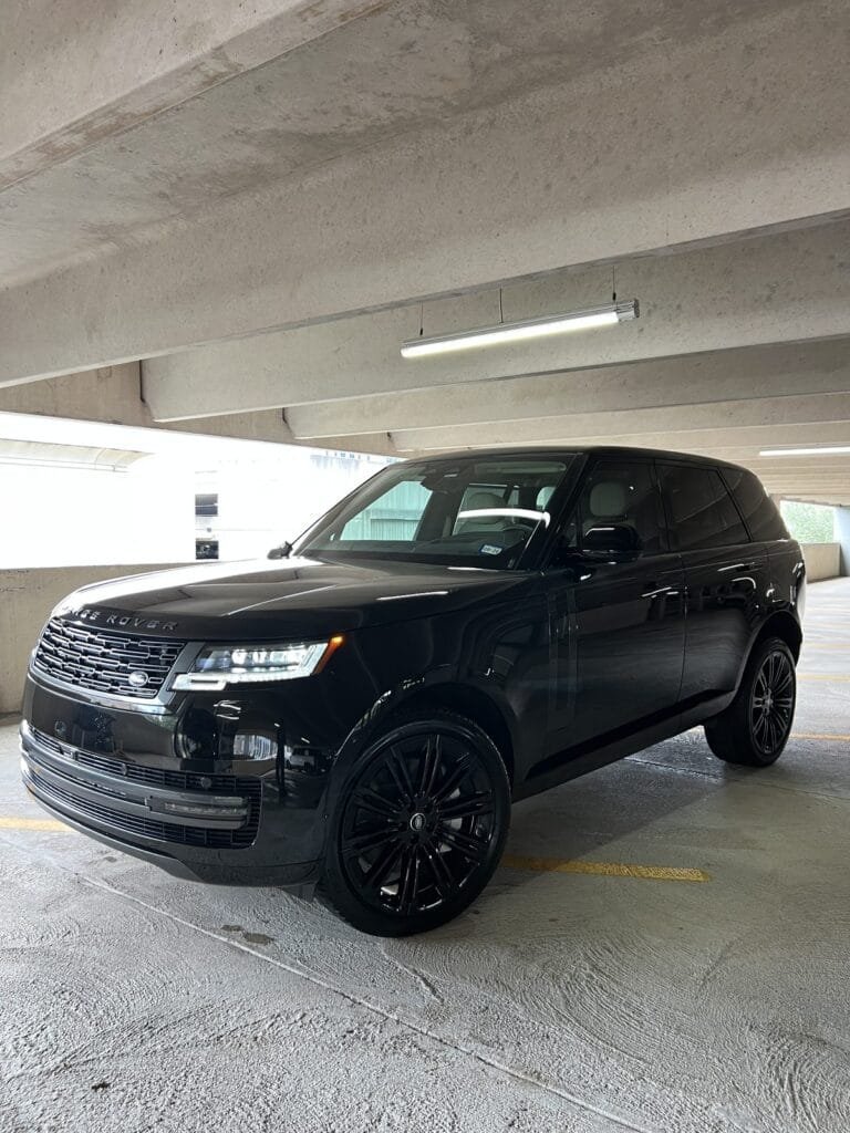 The same Range Rover after its Full Detail, clean and glossy in the parking garage