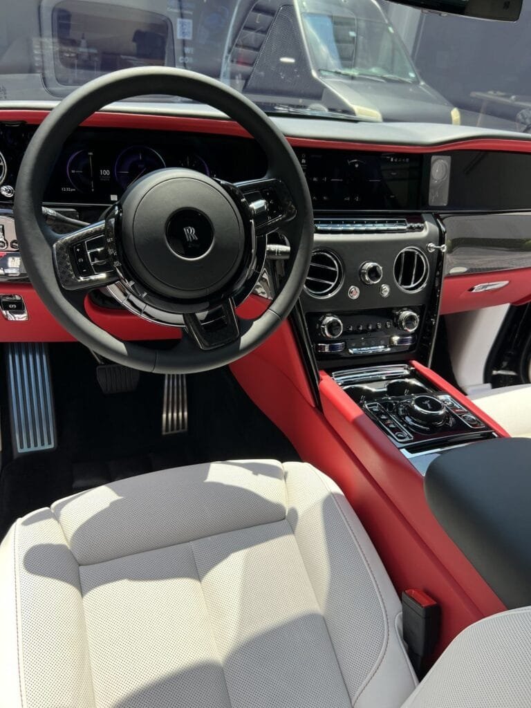 Rolls-Royce interior with white leather seats and red trim after an Azul Full Detail with Interior Ceramic Protection