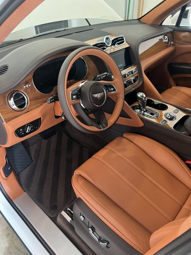 Bentley Bentayga interior with saddle leather seats and walnut trim after an Azul interior detail in Houston