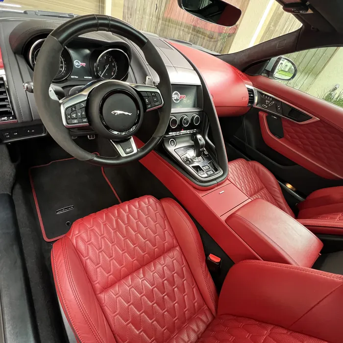 Jaguar F-Type interior with red quilted leather after an interior detail