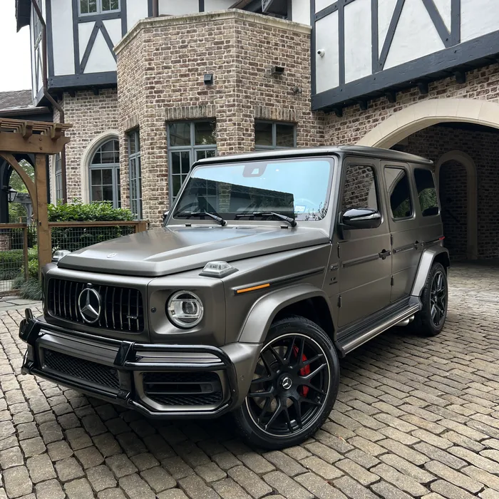 Matte gray Mercedes-AMG G 63 after a detail, in front of a River Oaks home