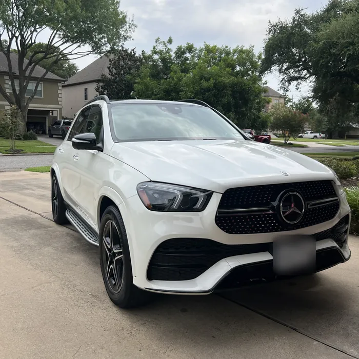 White Mercedes-Benz GLE after a detail in a driveway