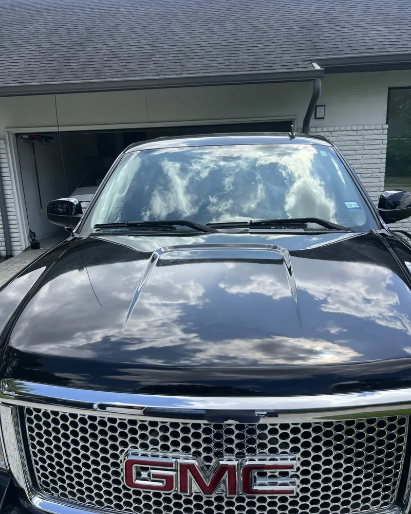 The same GMC hood after One-Step Paint Correction and a 3-Year Ceramic Coating