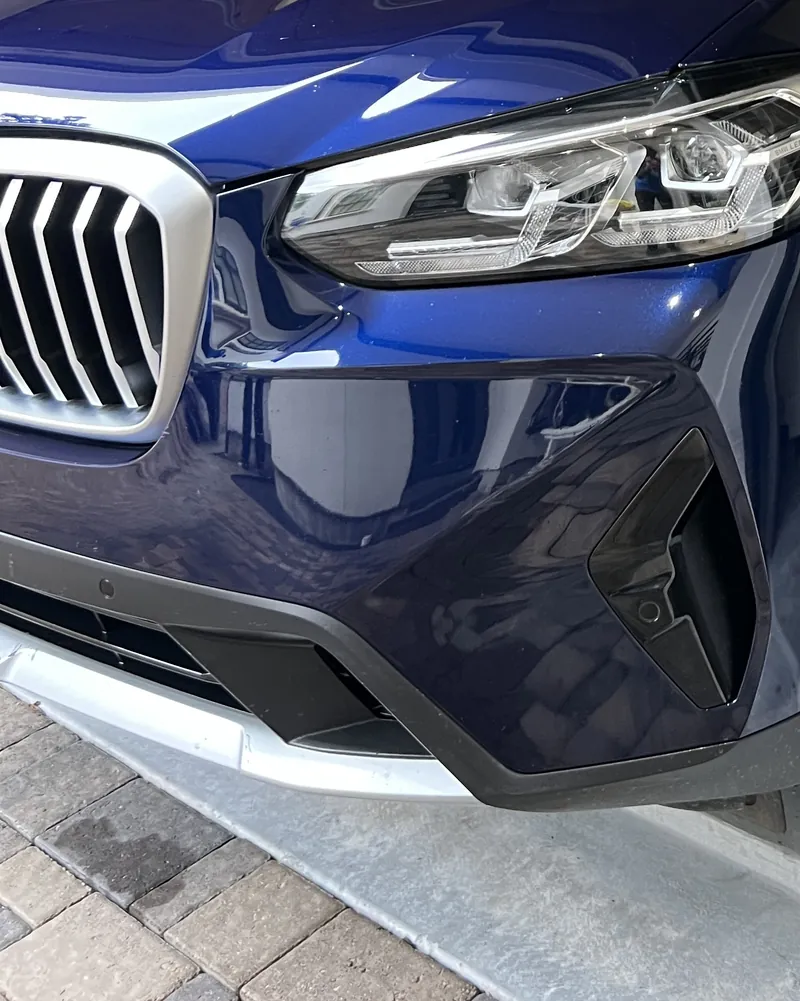 The same BMW X3 bumper corner after paint transfer removal and Two-Stage Paint Correction
