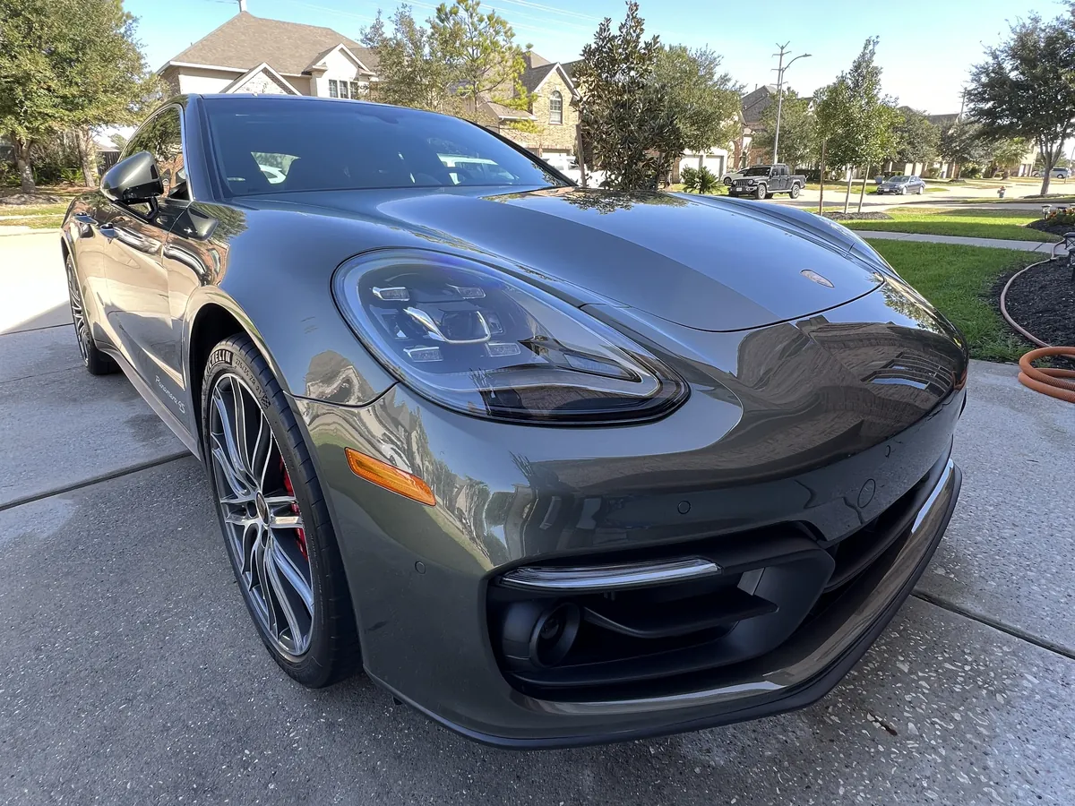 Gray Porsche Panamera after an Azul detail, parked in a Pearland driveway