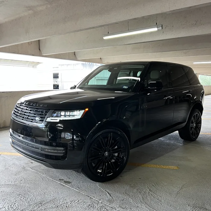 Black Range Rover after a detail in a parking garage