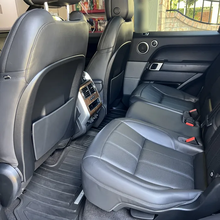 Range Rover Sport rear seats and floor mats after an interior detail