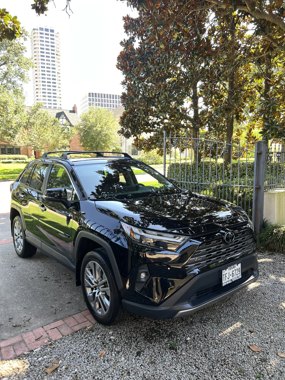 Glossy black Toyota RAV4 photographed after two-step paint correction and paint sealant