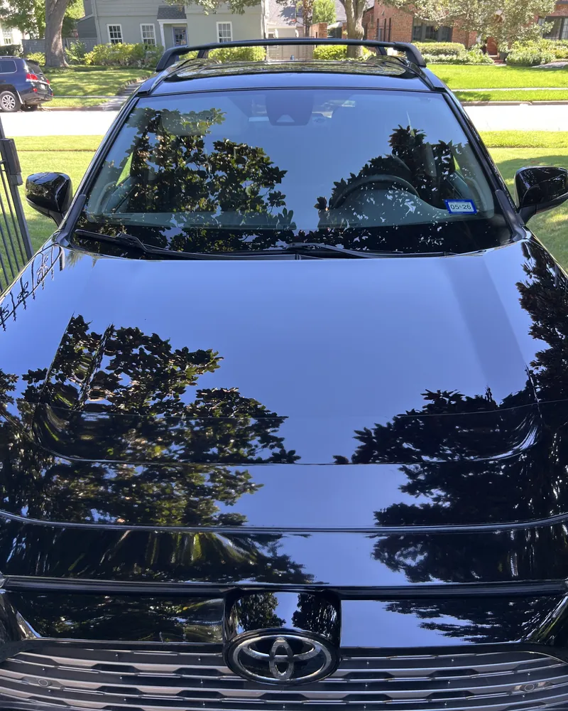 The same RAV4 hood after Two-Stage Paint Correction, with clear reflections